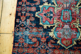 Vintage Persian Dargezine rug fragment, expressive red medallion and sky blue Herati on navy field.