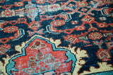 Intricate Herati pattern on the Dargezine rug, showcasing ruby red, sky blue, and navy.
