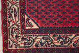 Vintage Serbend rug corner, featuring cherry red Mir field and detailed cream and blue border.