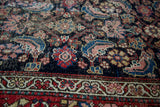 Distressed Herati pattern on dark blue, with red border of antique Northwest Persian rug.