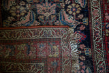 Antique Northwest Persian rug's secured edge, showing herati pattern and woven foundation.