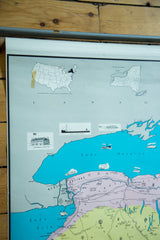 Upper part of vintage 1960s pull-down New York map with pastel vignettes.