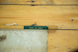 Antique Rand McNally map's wooden bar with green label and wrinkled beige paper.