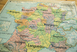 Antique map of France showing eastern 1789 provinces, with subtle colors and canvas patina.