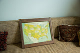 Early 1900s folk art map of United States on tin, with wood frame, 18x21 inches.