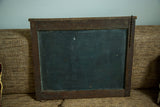 Dark chalk paint surface on the reverse with an aged wood frame and chain.