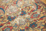 Expressive red, blue, and pink serrated leaf design on antique Sultanabad rug's gold field.