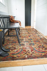 Traditional antique Persian Sultanabad rug with expressive serrated leaf design on a gold field.