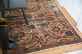 Antique Sultanabad rug with dramatic serrated leaf drawing on its unique gold field.