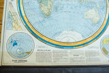 Portion of 1938 Cram's map, Water Hemisphere and detailed zodiac text, subdued colors.