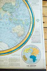 Land Hemisphere inset map featuring varied continent colors and textual information.