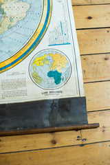Vintage Cram's Land Hemisphere map's aged canvas backing and separating bottom dowel.