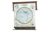 Cram's 1938 Western Hemisphere pulldown map, muted blue-green landmasses, original wood hardware.