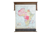 1938 Cram's vintage pulldown map of Africa, subdued pastel colors, original wood hardware.
