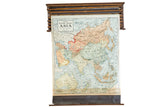 Crams 1938 Edition Pulldown Map of Asia with subdued colors and original wooden hardware, 44x54 inches.