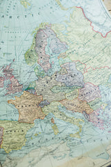 Vintage 1938 Cram's map with subdued colors, highlighting France, Italy, and Spain.