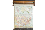 1938 Crams vintage pulldown map of United States with subdued colors, original hardware, and aged canvas.