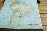 Angled view of the vintage Crams South America map, showing its muted palette and the Excello Series title block.