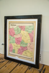 Antique Bedford NY map, pastel colors, visible aging along the bottom edge, dark frame.