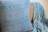 Subtle white stripes on indigo blue, finely handwoven textile pillow.