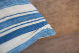 Textural detail of the indigo and ivory striped pillow with charming aged character.
