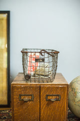 Mid Century industrial wire basket with original metal tag and top hook.