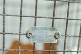 Vintage Fred Medart Products silvery metal tag '21' on rusted wire basket.