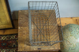 Vintage Fred Medart gym locker wire basket highlighting its irregular wire grid.