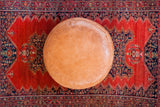 Antique Revival camel brown leather Moroccan pouf ottoman, flower fan stenciling.