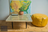 Handmade Mod Square coffee table with a glass top over an intricate wooden slat grid on tapered legs.