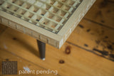 Intricate corner joinery and glass top of the handmade wooden Mod Square Table.