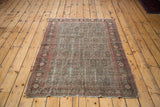 Distressed Antique Senneh rug, lower left corner with intricate faded green and red boteh.