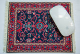 Mouse pad with classic deep indigo and ruby red Turkish vine and tendril design.