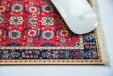 Pashmina Flowers Mouse Pad with white mouse and intricate red Mahi Herati design.