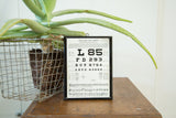 Unique vintage eye chart near vision plaque in a black frame, 8.25 by 6 inches.