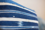 Handwoven indigo striped pillow textile, with unique variegated blue shades.
