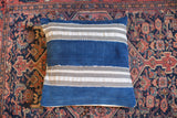 Indigo Mudcloth Throw Pillow featuring thick indigo blue, grey, and cream stripes.