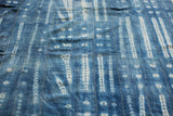Vintage African indigo textile with striped Batik patterns.