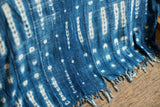 Vintage Batik Blue hand-woven indigo throw with intricate white patterns and a raw fringed edge.