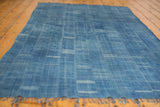 Handwoven African denim batik textile with variegated blue tones and subtle textural pattern.