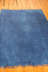 Collectible hand-woven African indigo textile, nuanced blue tones, and fringed edge.