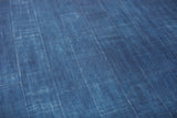 Collectible vintage African indigo textile, hand-dyed with rich blue irregular patterns.