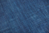 Vintage Denim Batik Throw's hand-woven texture with organic indigo blue dye variations.