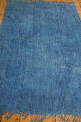 Close-up of vintage Denim Batik Textile, showing hand-woven vertical panels and blue patina.