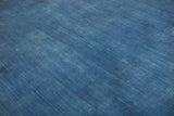 Vintage hand-woven indigo textile's textured stripes and subtle patina.
