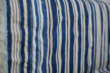 Collectible vintage indigo stripe textile, showing handwoven texture and subtle stitch detail.