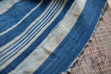 Vintage Indigo Stripe Throw with blue, natural hand-woven cotton, textured stripes, visible join.