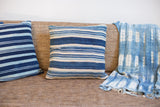 Striped Indigo Throw Pillow in varied blue and ivory, with visible mending, 16x16.