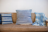 Finely handwoven indigo pillow, strong off-white horizontal stripes.