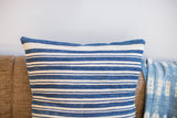 Detail of the finely woven off-white and dark blue striped African indigo pillow.